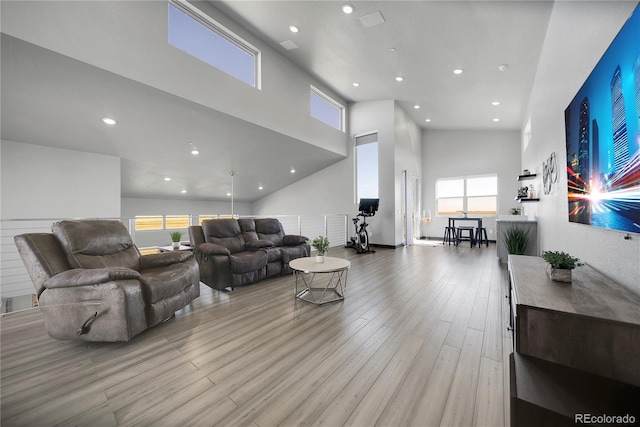 11680 Imboden Rd, Hudson, CO 80642 - living room featuring a high ceiling, wood finished floors, and recessed lighting