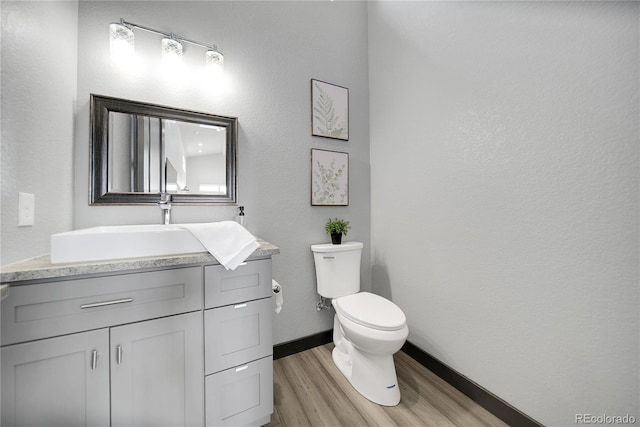 11680 Imboden Rd, Hudson, CO 80642 - half bath with wood finished floors, vanity, and a textured wall