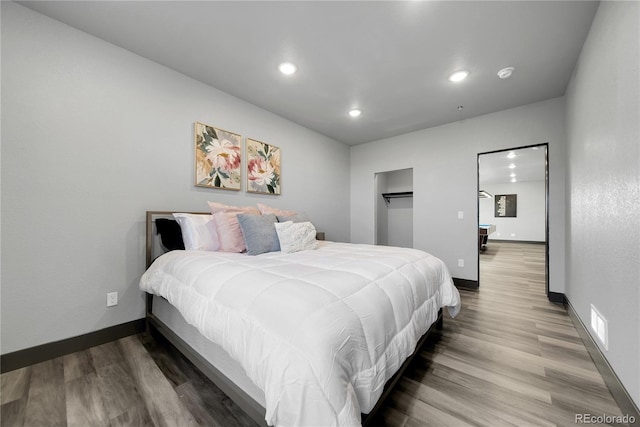 11680 Imboden Rd, Hudson, CO 80642 - bedroom with wood finished floors and recessed lighting