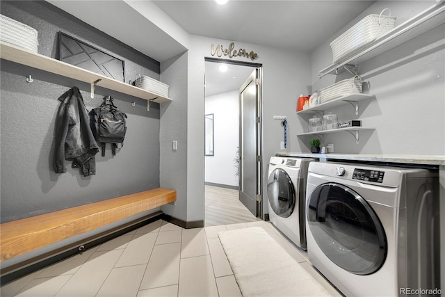 11680 Imboden Rd, Hudson, CO 80642 - washroom featuring washing machine and dryer and light tile patterned flooring