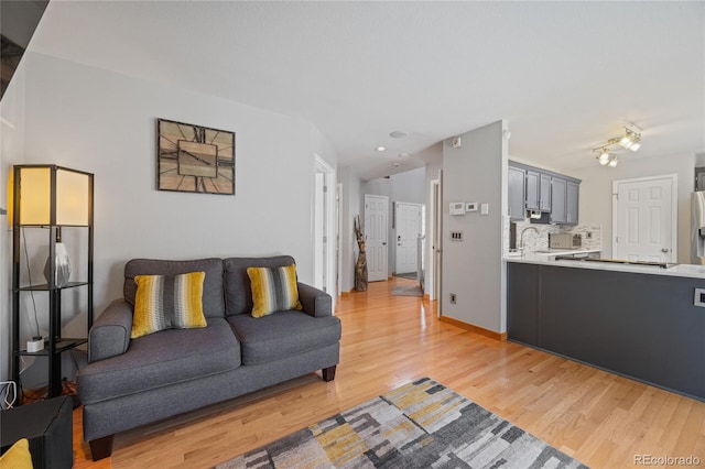 15157 E Nassau Ave, Aurora, CO 80014 - living room with light wood-style flooring and recessed lighting