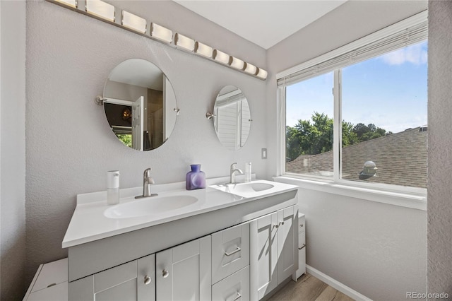 15157 E Nassau Ave, Aurora, CO 80014 - full bath featuring double vanity and wood finished floors