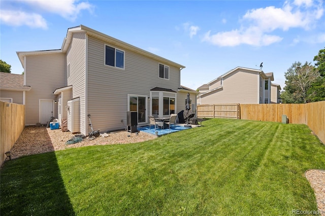 15157 E Nassau Ave, Aurora, CO 80014 - rear view of house with a patio and a fenced backyard
