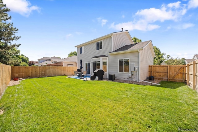 15157 E Nassau Ave, Aurora, CO 80014 - rear view of property with a fenced backyard and a patio