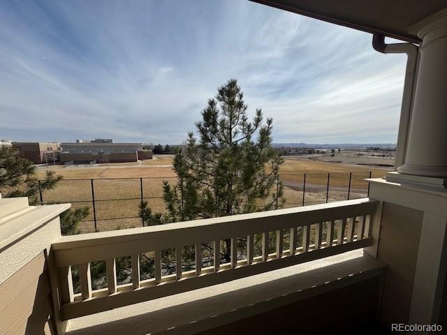 balcony featuring a rural view