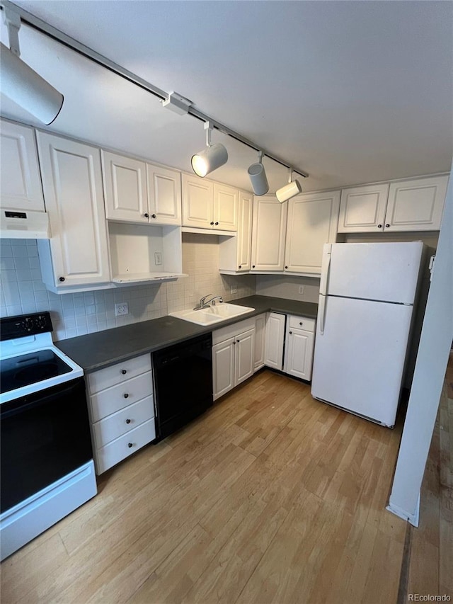 1245 N Race St Unit 306, Denver, CO 80206 - kitchen with black appliances, dark countertops, and white cabinets