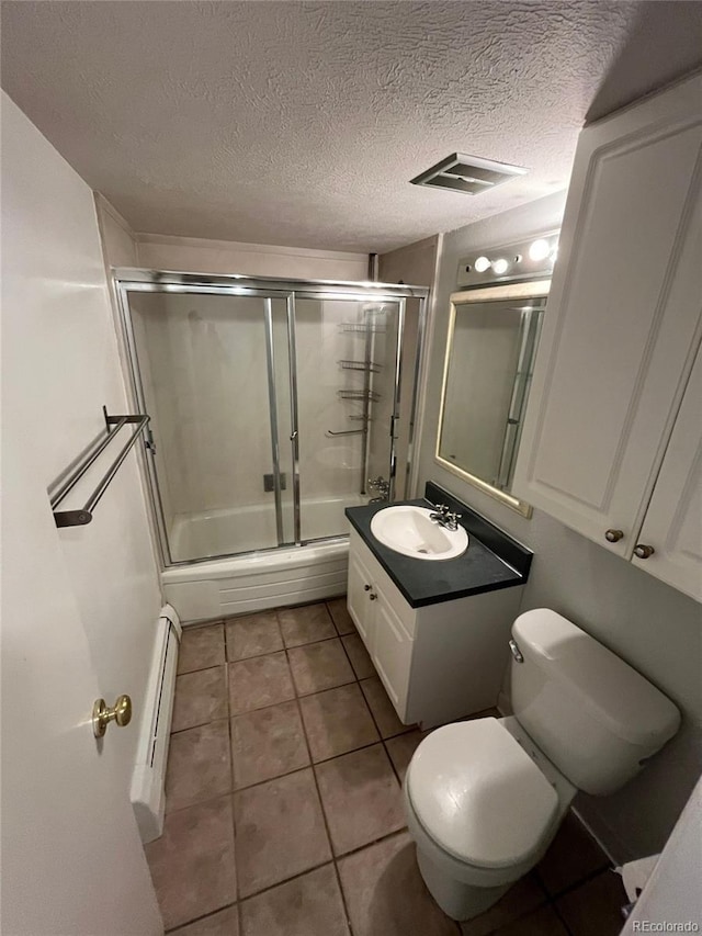 1245 N Race St Unit 306, Denver, CO 80206 - full bath featuring vanity, baseboard heating, shower / bath combination with glass door, tile patterned flooring, and a textured ceiling