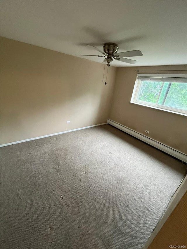 1245 N Race St Unit 306, Denver, CO 80206 - carpeted spare room featuring a baseboard radiator and a ceiling fan