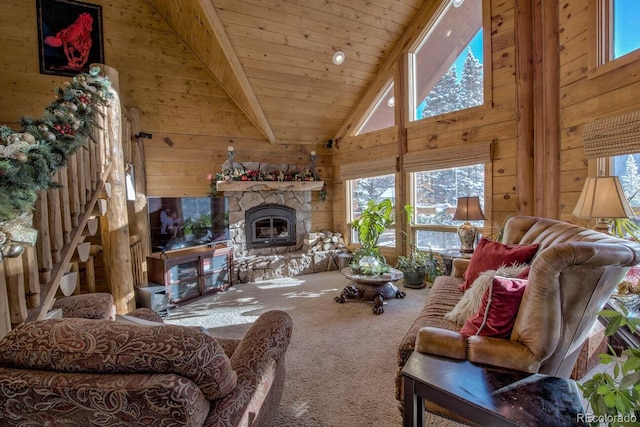 carpeted living room with wooden ceiling, wooden walls, high vaulted ceiling, and a fireplace