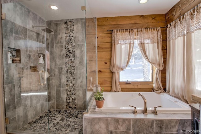 bathroom featuring separate shower and tub and vanity