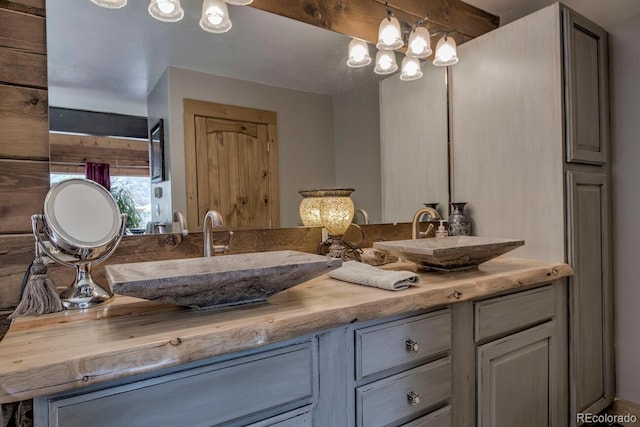 bathroom featuring vanity and a chandelier