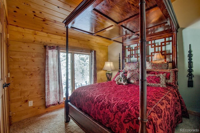 bedroom with carpet floors, wooden walls, and wooden ceiling