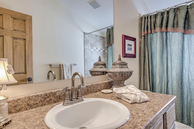 bathroom with a shower with curtain and vanity