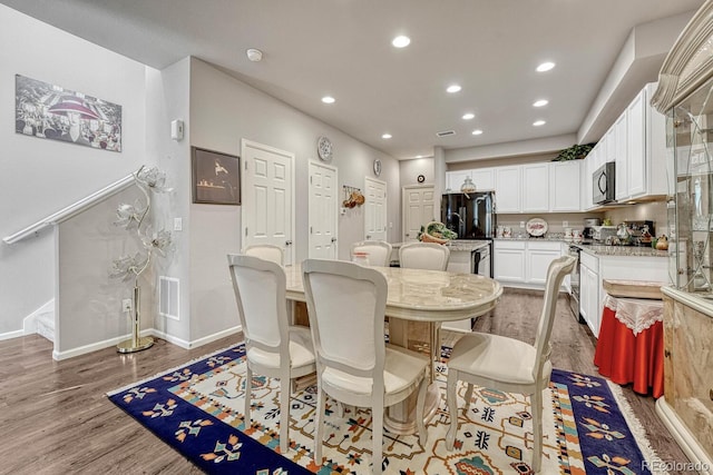 dining room featuring hardwood / wood-style flooring