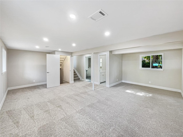 basement with light colored carpet