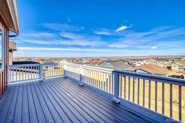 wooden deck featuring a residential view