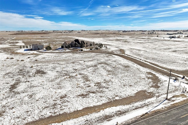 snowy aerial view with a rural view