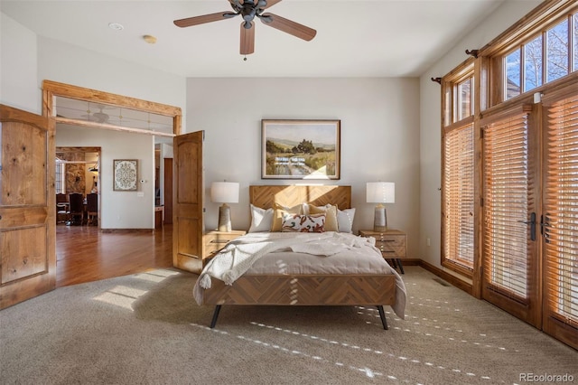 carpeted bedroom featuring access to exterior and ceiling fan