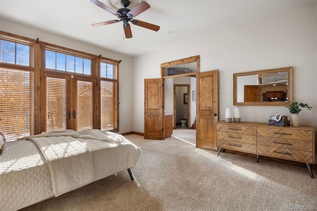 bedroom featuring light carpet and ceiling fan