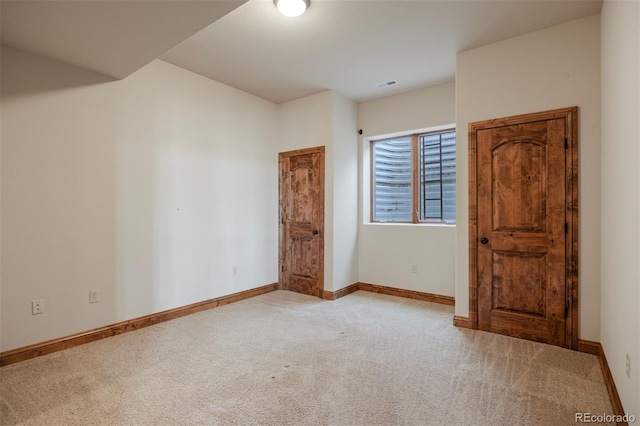 unfurnished bedroom with light carpet