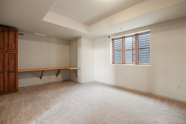 basement with light colored carpet