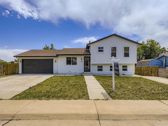 2830 E 99th Way, Thornton, CO 80229 - split level home with an attached garage, concrete driveway, and stucco siding