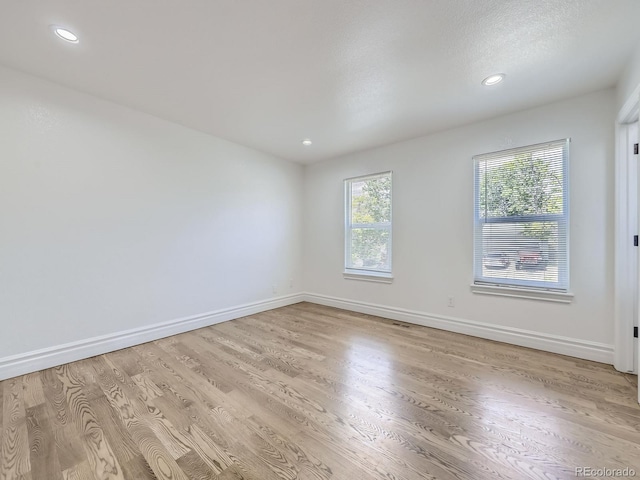 2830 E 99th Way, Thornton, CO 80229 - unfurnished room with light wood-style flooring and recessed lighting