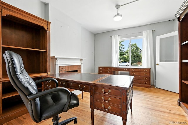 2346 N Gilpin St, Denver, CO 80205 - office featuring light wood finished floors and a fireplace
