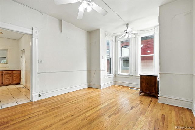 2346 N Gilpin St, Denver, CO 80205 - unfurnished room with ceiling fan and light wood finished floors