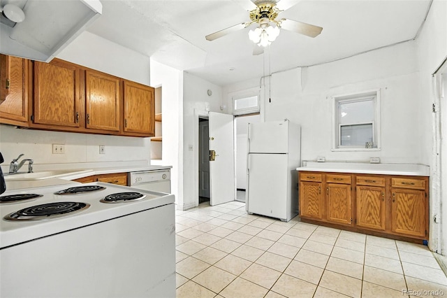 2346 N Gilpin St, Denver, CO 80205 - kitchen featuring white appliances, brown cabinets, light tile patterned floors, and ceiling fan