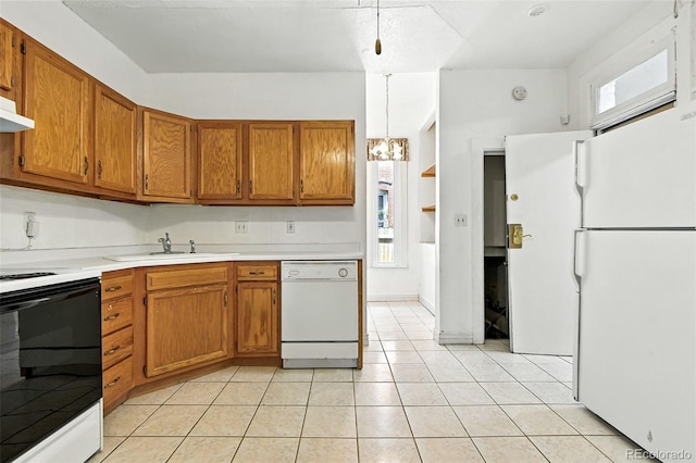 2346 N Gilpin St, Denver, CO 80205 - kitchen featuring white appliances, brown cabinetry, light countertops, light tile patterned floors, and a chandelier