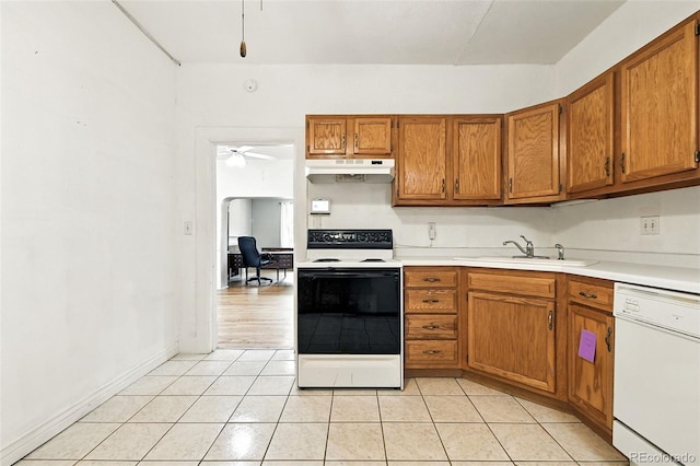 2346 N Gilpin St, Denver, CO 80205 - kitchen with electric stove, white dishwasher, light tile patterned floors, brown cabinets, and light countertops