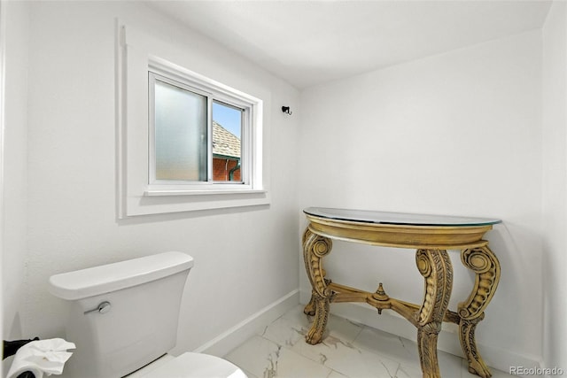 2346 N Gilpin St, Denver, CO 80205 - bathroom with toilet and marble look tiles