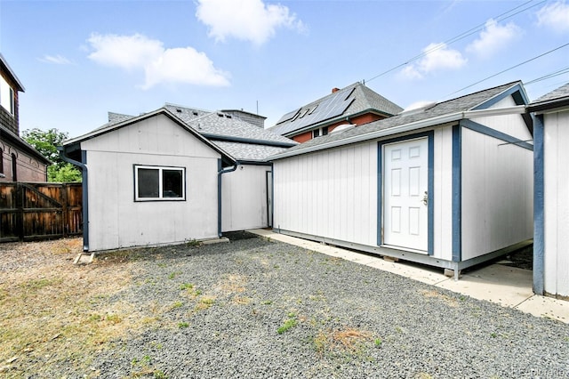 2346 N Gilpin St, Denver, CO 80205 - rear view of property with roof with shingles and a storage unit