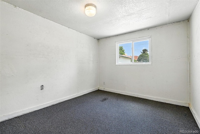 2346 N Gilpin St, Denver, CO 80205 - carpeted empty room with a textured ceiling and baseboards