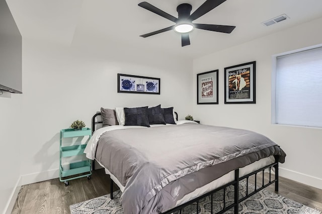 1655 Wolff St, Denver, CO 80204 - bedroom with baseboards, wood finished floors, and a ceiling fan