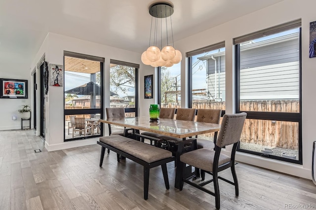 1655 Wolff St, Denver, CO 80204 - dining space featuring light wood-style flooring and baseboards