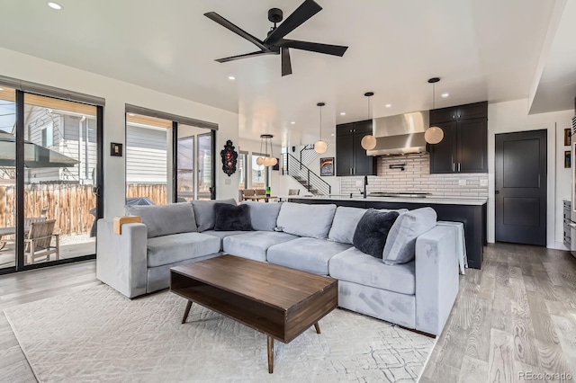 1655 Wolff St, Denver, CO 80204 - living area with ceiling fan, light wood finished floors, and recessed lighting