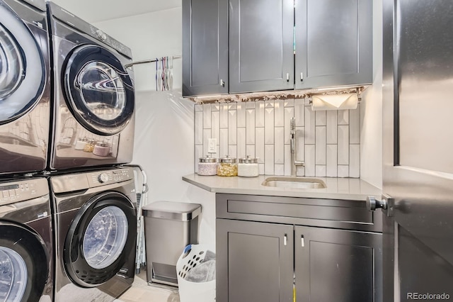 1655 Wolff St, Denver, CO 80204 - washroom with cabinet space and stacked washer / drying machine