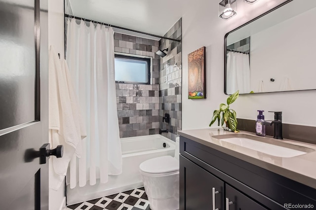 1655 Wolff St, Denver, CO 80204 - bathroom featuring vanity, shower / bath combo with shower curtain, toilet, and tile patterned floors
