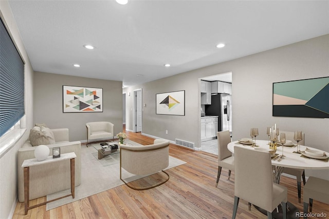 8305 Eaton Way, Arvada, CO 80003 - living room featuring light wood-style flooring, recessed lighting, and baseboards