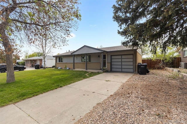 8305 Eaton Way, Arvada, CO 80003 - single story home with brick siding, a garage, and concrete driveway
