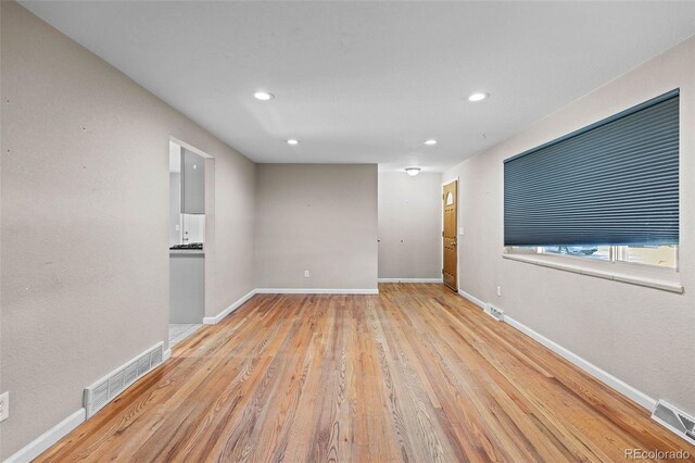 8305 Eaton Way, Arvada, CO 80003 - empty room with recessed lighting, wood finished floors, and baseboards