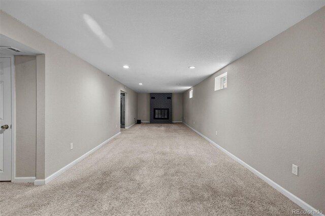 8305 Eaton Way, Arvada, CO 80003 - empty room featuring carpet floors, recessed lighting, baseboards, and a large fireplace