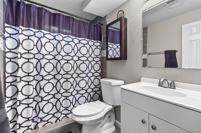 8305 Eaton Way, Arvada, CO 80003 - full bathroom featuring a textured wall, toilet, vanity, and curtained shower