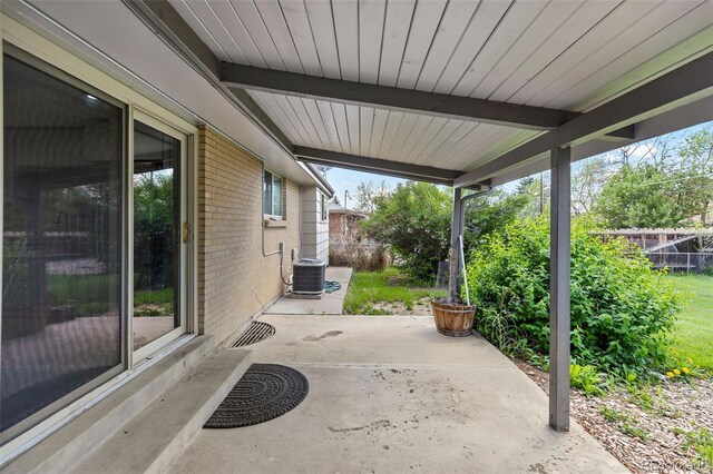 8305 Eaton Way, Arvada, CO 80003 - fenced backyard with a patio area and central AC