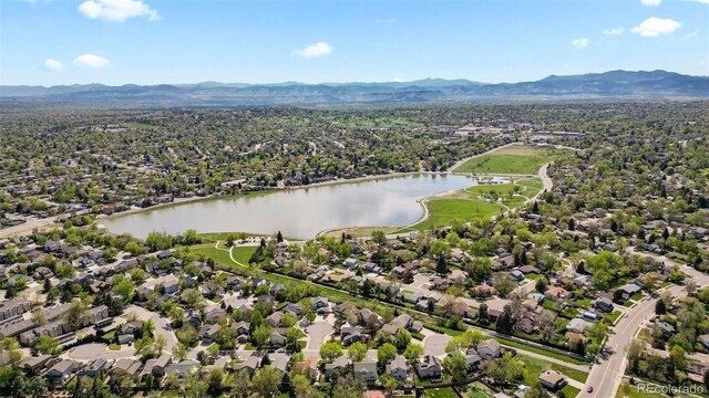 8305 Eaton Way, Arvada, CO 80003 - aerial view of property and surrounding area featuring a water and mountain view and nearby suburban area