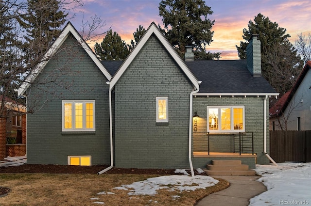 view of back house at dusk