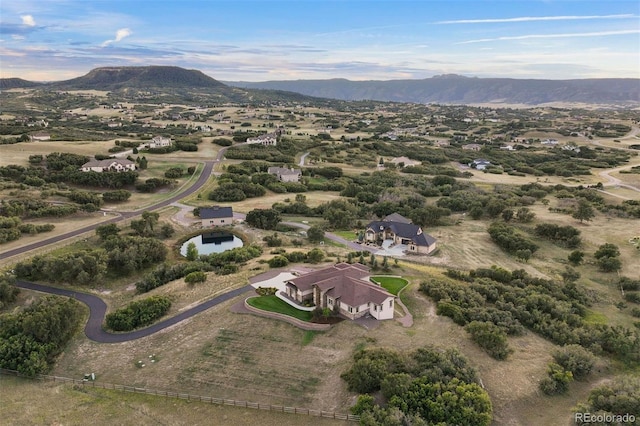 birds eye view of property featuring a mountain view