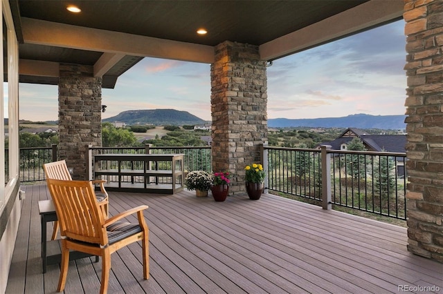 deck at dusk with a mountain view